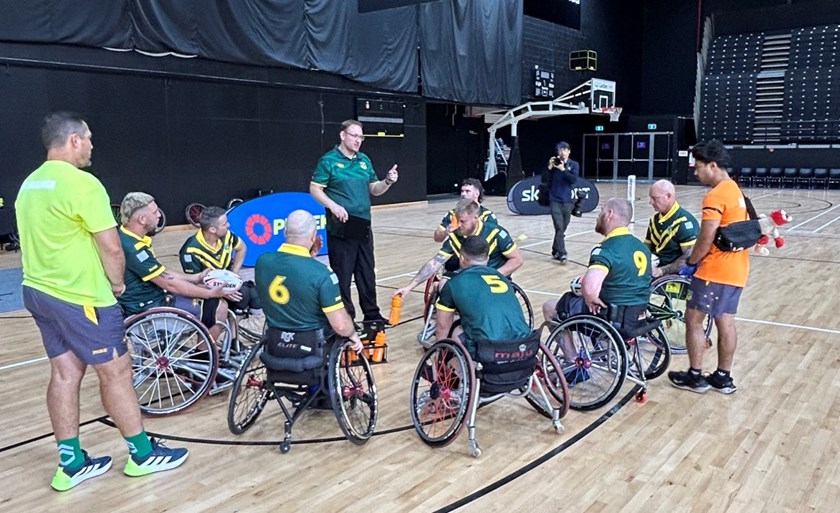 Wheelaroos coach Brett Clark addresses his players at halftime during the inaugural trans-Tasman match against the Wheel Kiwis in Auckland.