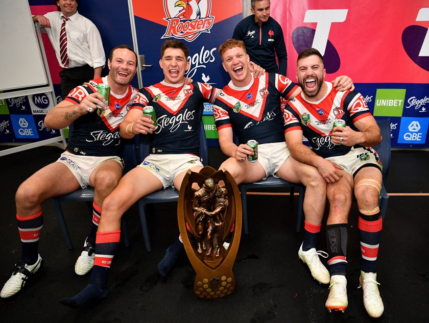 Dylan Napa celebrates the 2018 grand final win with Roosters team-mates Boyd Cordner, Victor Radley and James Tedesco